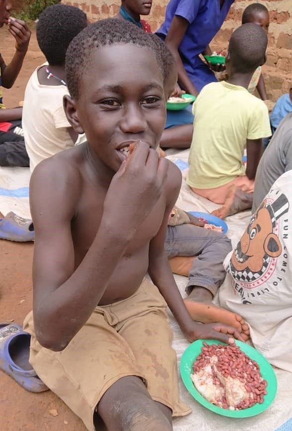 Children eating at feeding center